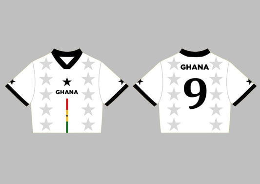 Two white sports jerseys with black accents on a yellow background, featuring the word 'Ghana' and star patterns.